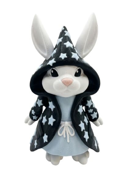 Figurine lapin mage décor étoilé noir et blanc