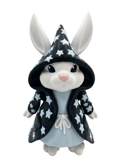 Figurine lapin mage décor étoilé noir et blanc